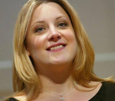 Pastor Lisa Milne Young speaking during a Christian leadership conference.